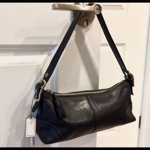 COACH black leather shoulder purse.  Blue thread